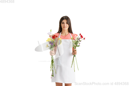 Image of Young woman, florist with bouquet isolated on white studio background