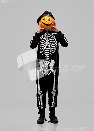 Image of boy in halloween costume with jack-o-lantern