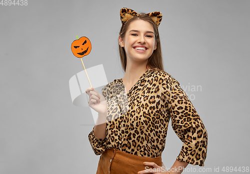 Image of happy woman in halloween costume of leopard