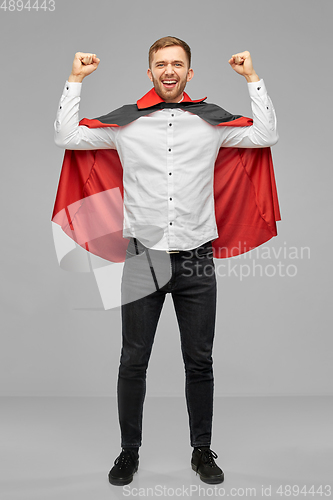 Image of happy man costume of vampire celebrating success