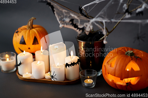 Image of pumpkins, candles and halloween decorations