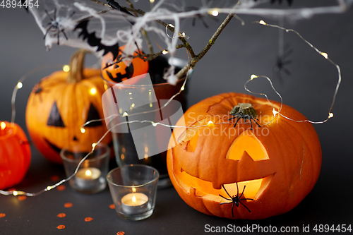 Image of pumpkins, candles and halloween decorations