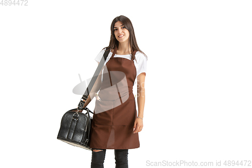 Image of Young woman, visagiste with cosmetics isolated on white studio background