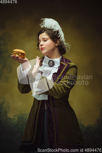 Image of Modern trendy look, portrait of renaissance period beautiful woman. Retro style, comparison of eras concept.