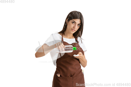 Image of Young woman, visagiste with cosmetics isolated on white studio background