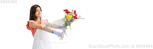 Image of Young woman, florist with bouquet isolated on white studio background