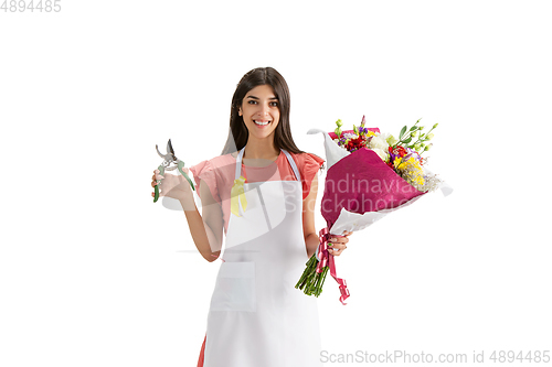 Image of Young woman, florist with bouquet isolated on white studio background