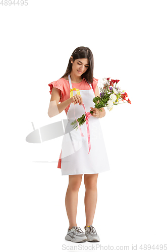 Image of Young woman, florist with bouquet isolated on white studio background
