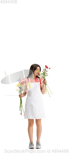 Image of Young woman, florist with bouquet isolated on white studio background