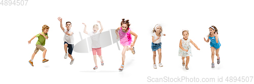 Image of Happy little caucasian kids jumping and running isolated on white background