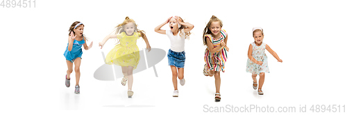 Image of Happy little caucasian kids jumping and running isolated on white background