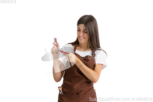 Image of Young woman, visagiste with cosmetics isolated on white studio background