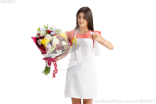 Image of Young woman, florist with bouquet isolated on white studio background