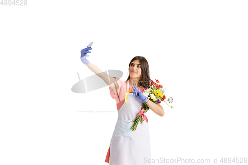 Image of Young woman, florist with bouquet isolated on white studio background