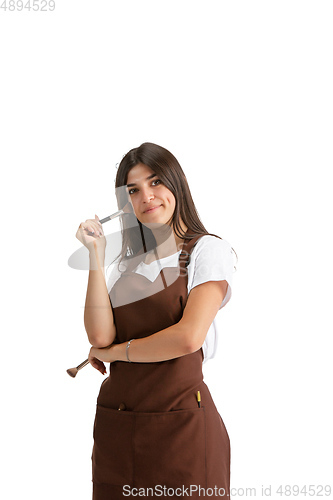 Image of Young woman, visagiste with cosmetics isolated on white studio background