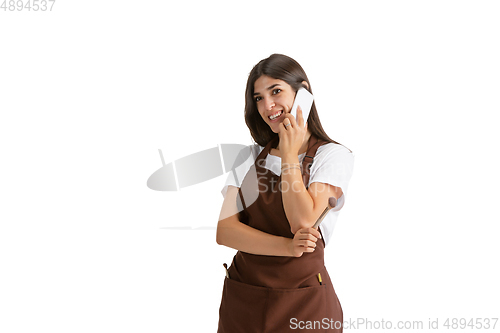 Image of Young woman, visagiste with cosmetics isolated on white studio background