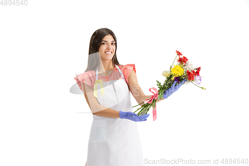 Image of Young woman, florist with bouquet isolated on white studio background