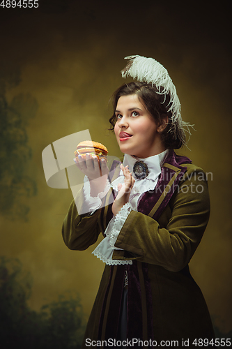 Image of Modern trendy look, portrait of renaissance period beautiful woman. Retro style, comparison of eras concept.