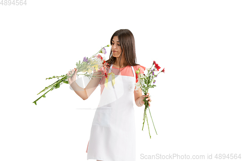 Image of Young woman, florist with bouquet isolated on white studio background