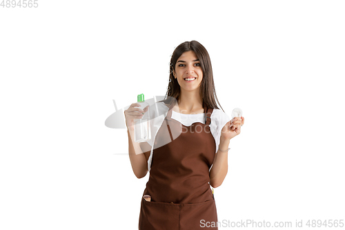 Image of Young woman, visagiste with cosmetics isolated on white studio background