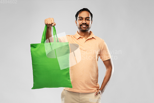 Image of man with reusable canvas bag for food shopping