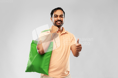 Image of man with reusable canvas bag for food shopping