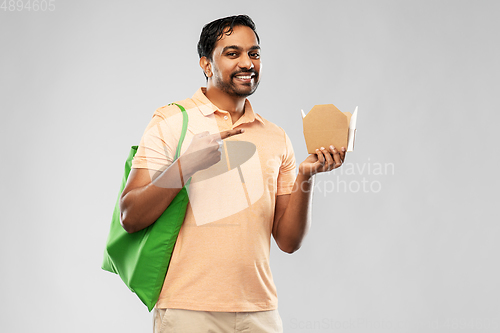 Image of man with reusable shopping bag and takeout food
