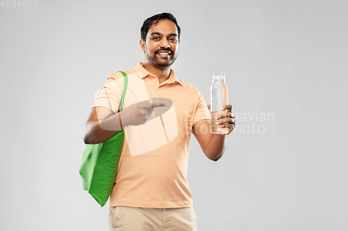 Image of man with bag for food shopping and glass bottle