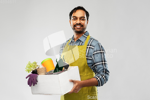 Image of indian gardener or farmer with box of garden tools