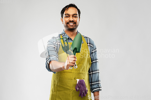 Image of indian gardener or farmer with box of garden tools