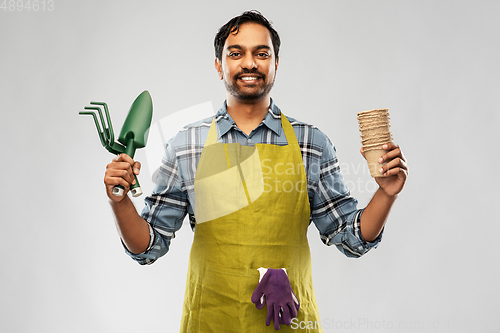 Image of indian gardener or farmer with box of garden tools