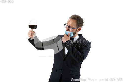 Image of Portrait of male sommelier in suit isolated over white background