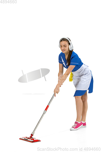 Image of Portrait of female made, cleaning worker in white and blue uniform isolated over white background