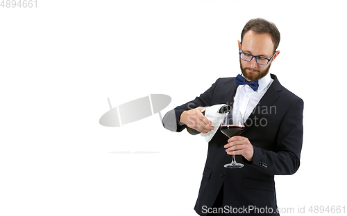 Image of Portrait of male sommelier in suit isolated over white background