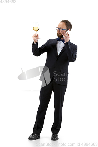 Image of Portrait of male sommelier in suit isolated over white background