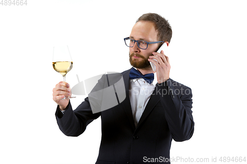 Image of Portrait of male sommelier in suit isolated over white background