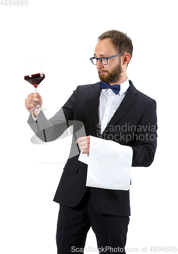 Image of Portrait of male sommelier in suit isolated over white background