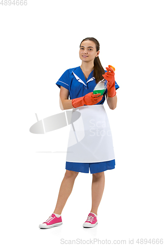 Image of Portrait of female made, cleaning worker in white and blue uniform isolated over white background