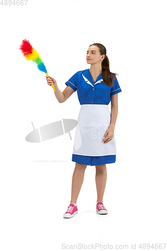 Image of Portrait of female made, cleaning worker in white and blue uniform isolated over white background