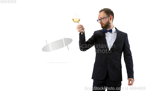 Image of Portrait of male sommelier in suit isolated over white background