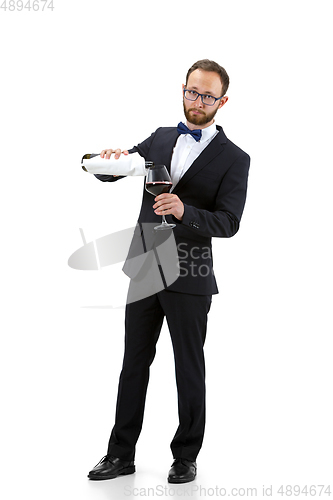 Image of Portrait of male sommelier in suit isolated over white background