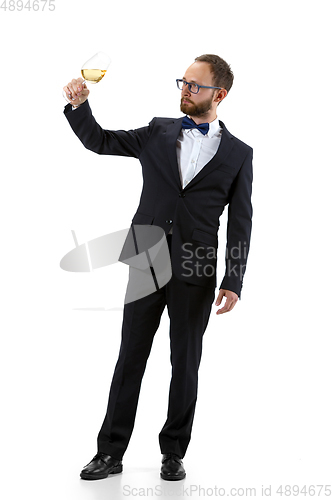 Image of Portrait of male sommelier in suit isolated over white background