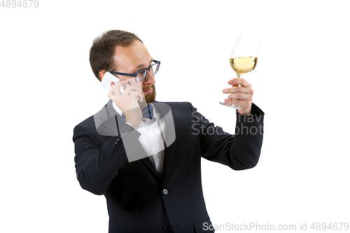 Image of Portrait of male sommelier in suit isolated over white background