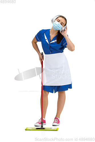 Image of Portrait of female made, cleaning worker in white and blue uniform isolated over white background