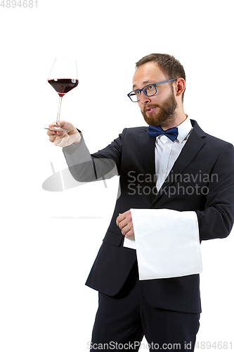 Image of Portrait of male sommelier in suit isolated over white background