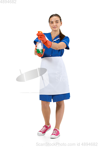 Image of Portrait of female made, cleaning worker in white and blue uniform isolated over white background