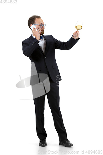 Image of Portrait of male sommelier in suit isolated over white background