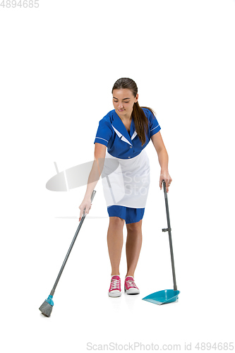 Image of Portrait of female made, cleaning worker in white and blue uniform isolated over white background