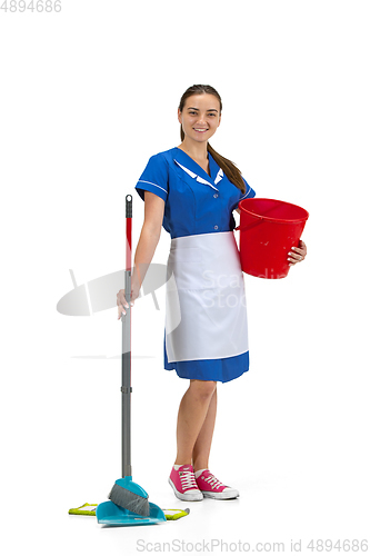 Image of Portrait of female made, cleaning worker in white and blue uniform isolated over white background