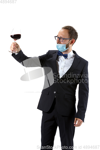 Image of Portrait of male sommelier in suit isolated over white background